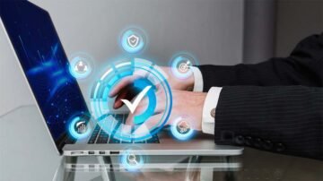 A laptop and symbol of ISO 9001 digital transformation